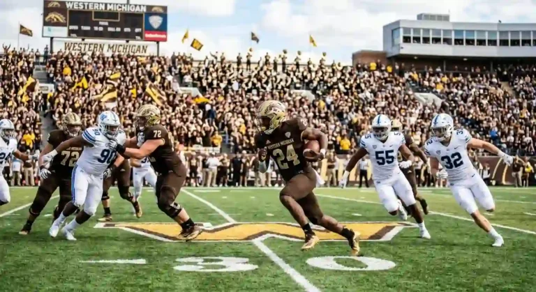 Action shot of a Western Michigan Broncos college football player running with the ball during a home game at Waldo Stadium.